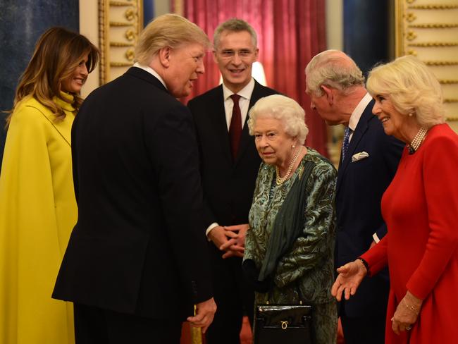 LONDON, ENGLAND - DECEMBER 03: Queen Elizabeth II talks to US President Donald Trump and wife Melania as she hosts a reception for NATO leaders at Buckingham Palace on December 3, 2019 in London, England. Her Majesty Queen Elizabeth II hosted the reception at Buckingham Palace for NATO Leaders to mark 70 years of the NATO Alliance. (Photo by Geoff Pugh - WPA Pool/Getty Images)