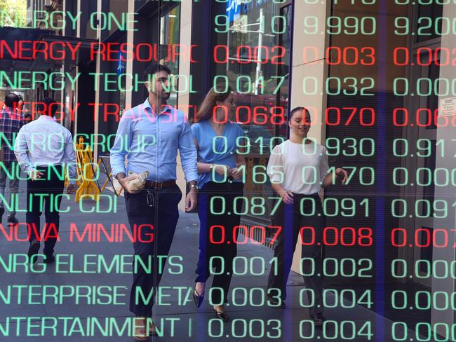 ????SYDNEY, AUSTRALIA : NewsWire Photos - FEBRUARY 24 2025; A general view of people walking past the digital boards of the ASX in the Sydney CBD. Picture: NewsWire/ Gaye Gerard