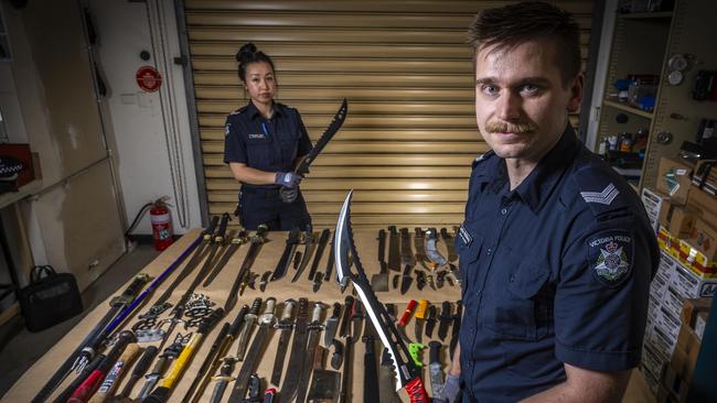 Police have seized a record number of knives. Senior Constable Michelle Chan and Senior Constable Lachlan McGillivray display a selection of the confiscated knives. Picture: Jake Nowakowski