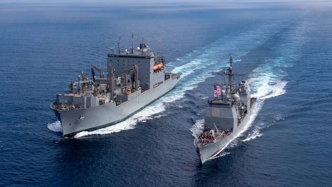 The USS Chosin, a guided-missile cruiser, sails alongside the larger USNS Washington Chambers, during testing of a new method of resupplying ships at sea. Picture: US Navy