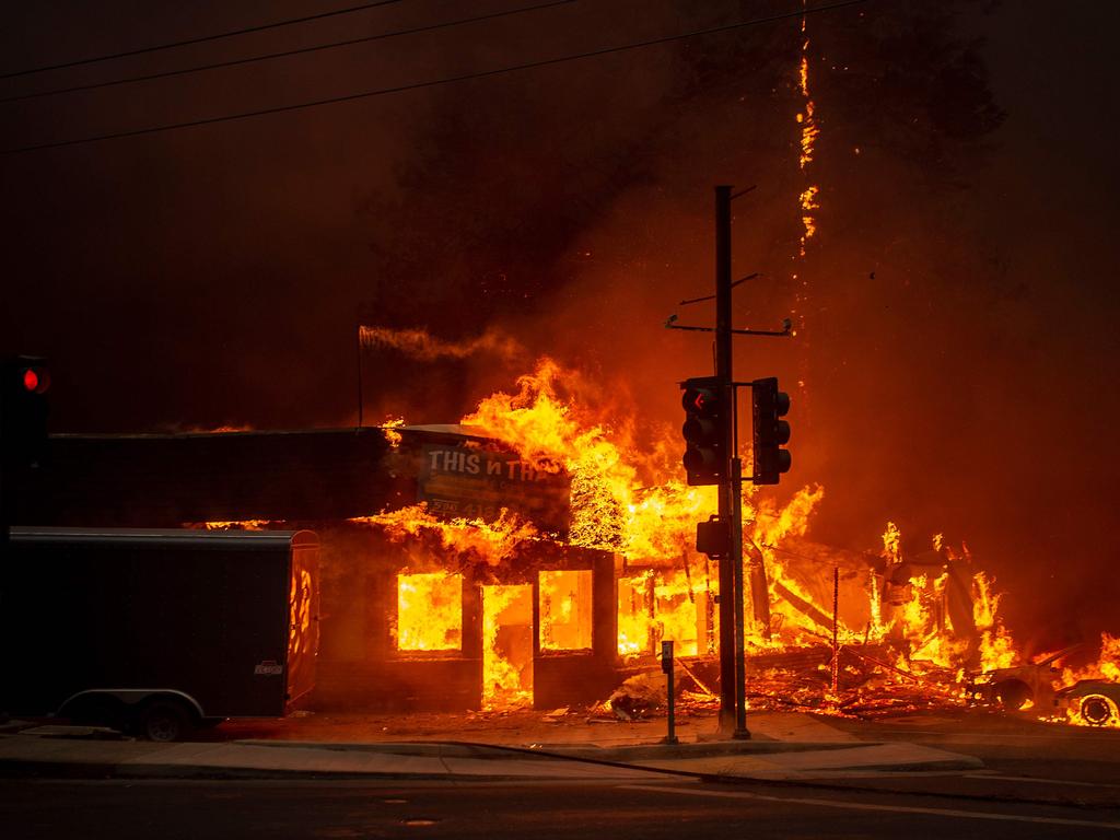 A store burns as the Camp fire tears through Paradise. Picture: Josh Edelson/AFP