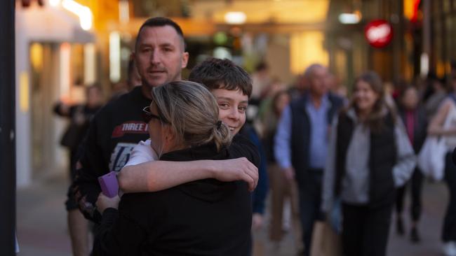 Families reunited following the terrifying incident. Picture: Brett Hartwig