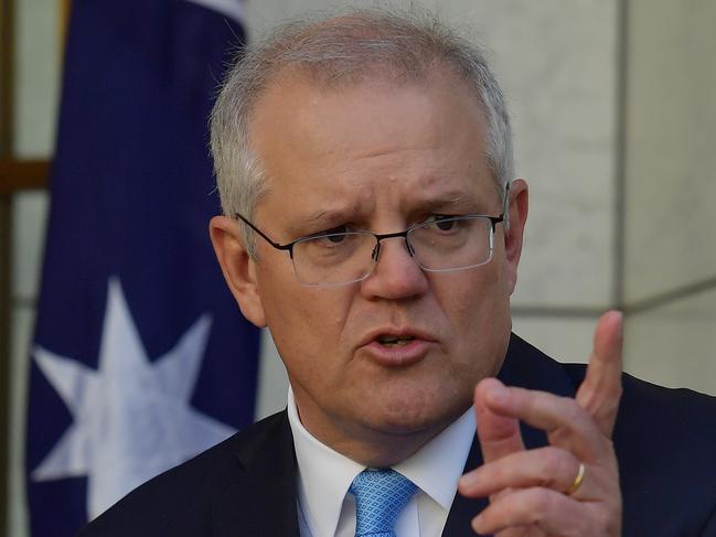 CANBERRA, AUSTRALIA - DECEMBER 11: Prime Minister Scott Morrison reacts during a press conference in the Prime Ministers courtyard on December 11, 2020 in Canberra, Australia. Clinical trials of a COVID-19 vaccine being developed by the University of Queensland in partnership with biotech company CSL will be abandoned, after the Federal Government had committed to purchasing, and agreements had been made to secure 51 million doses of the vaccine. (Photo by Sam Mooy/Getty Images)