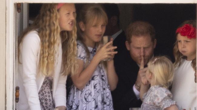 Prince Harry with Savannah Phillips and Mia Tindall in the Major General's office overlooking The Trooping of the Colour on Horse Guards Parade. Picture: Picture: Goffphotos