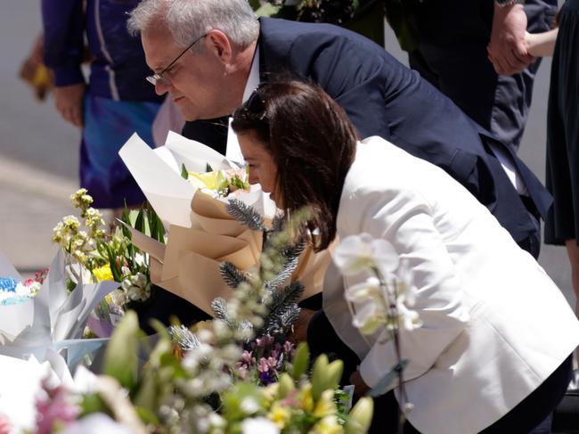 TASMANIA, AUSTRALIA - NewsWire Photos: DECEMBER 18 2021: Prime Minister Scott Morrison his wife Jenny lay flowers in tribute outside Hillcrest Primary School.  Picture: NCA NewsWire / Grant Viney