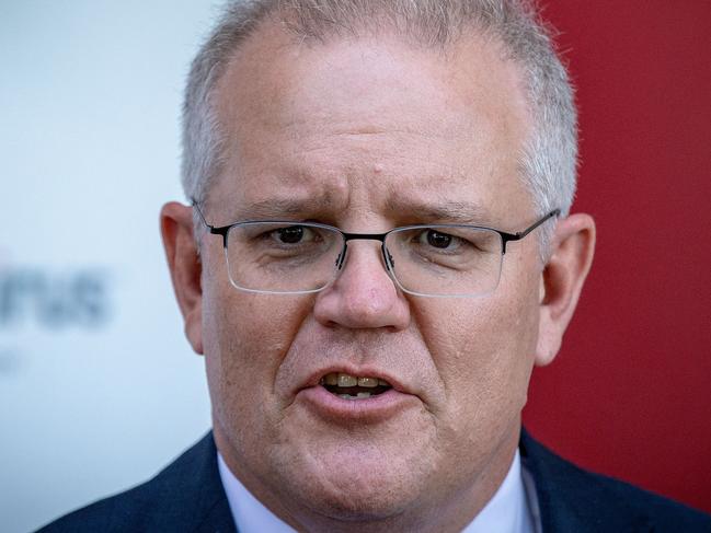 MELBOURNE, AUSTRALIA - NOVEMBER 16: Prime Minister Scott Morrison speaks during a press conference at CSL Lab where a COVID-19 Vaccine is being produced on November 16, 2020 in Melbourne, Australia. The federal government has announced a $1.8 billion agreement with pharmaceutical company CSL to construct a new biotech and vaccine manufacturing plant in Melbourne. The plant - to be the largest in the southern hemisphere - will deliver the first population-wide pandemic and seasonal flu vaccines for Australians, safeguarding the nation from global supply chain shortages or queues. (Photo by Darrian Traynor/Getty Images)