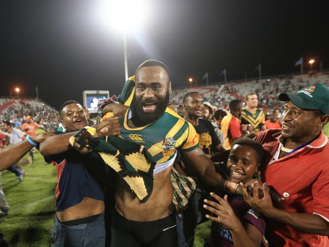 Semi Radradra struggles to keep his jersey as he’s swamped by fans in Port Moresby, Papua New Guinea. pic Mark Evans