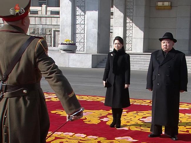 Kim and his wife Ri Sol-ju pictured attending the parade in Pyongyang. Picture: AFP/KCNA