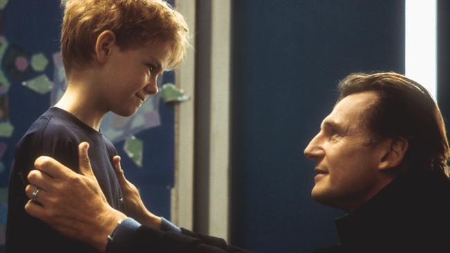 Thomas Sangster with Liam Neeson in Love Actually.