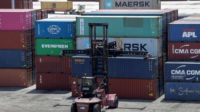 A forklift moves shipping containers at Miami Port. Picture: AFP