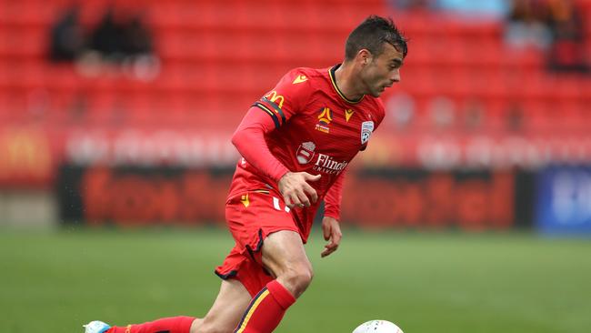 Adelaide United’s Nikola Mileusnic dribbling to ball in front of too many empty seats at Coopers Stadium. Picture: Robert Cianflone/Getty Images.