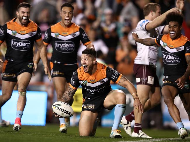 Malakai Watene-Zelezniak celebrates after scoring the winning try.