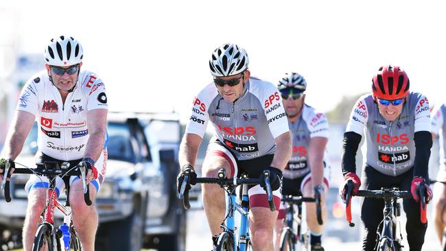 Former prime minister Tony Abbott (centre) joins MP Andrew Wallace (left) on last year’s Pollie Pedal. Picture: File