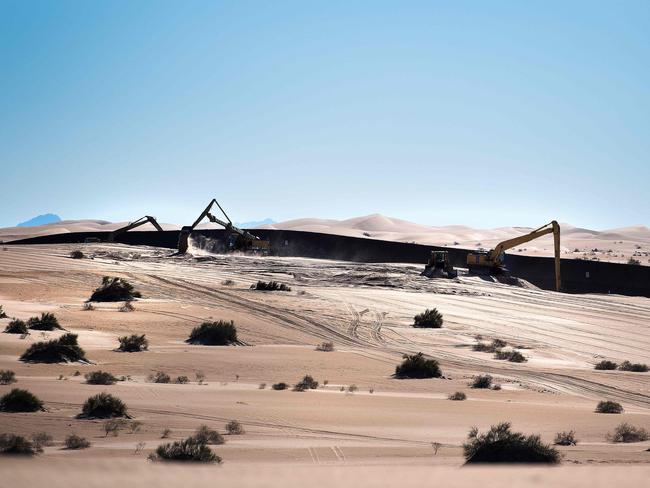 Trump has promised to build a wall and tax companies who moved their operations to Mexico at the expense of US jobs. Picture: AFP PHOTO / JIM WATSON