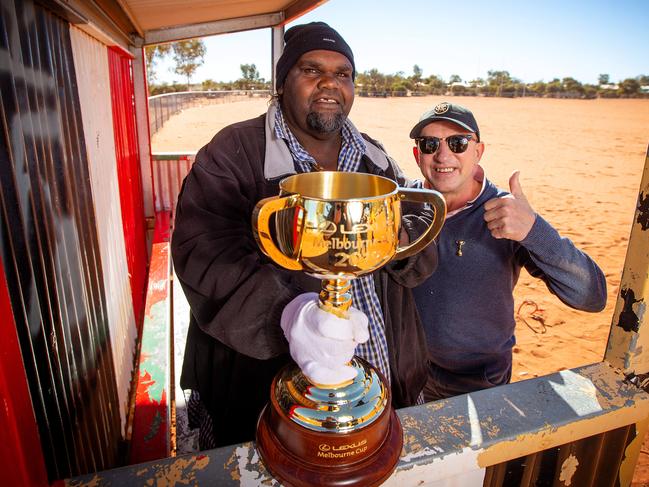 Jimmy Cassidy brings the Melbourne Cup to the Ltyentye Apurte Community, also known as Santa Teresa, an indigenous community located about 80km southeast of Alice Springs. Picture: Mark Stewart