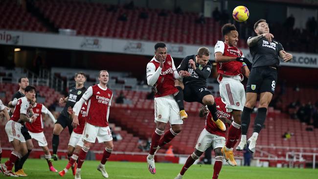 Arsenal striker Pierre-Emerick Aubameyang (second right) heads the ball toward the goal and into his own net to score an own goal against Burnley at the Emirates Stadium in London. Picture: AFP
