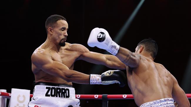 Jai Opetaia throws a fearsome left hook at England’s Ellis Zoro. Picture: Getty
