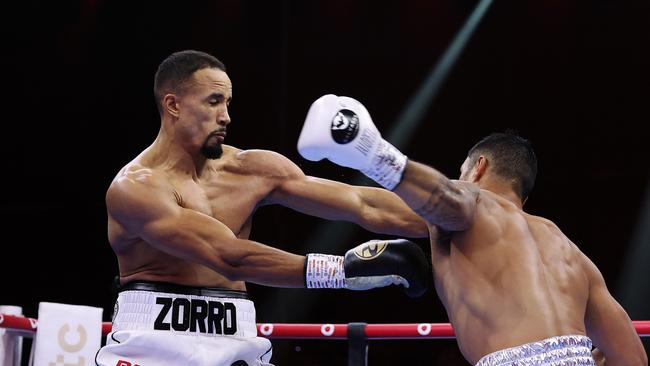 Jai Opetaia throws a fearsome left hook at England’s Ellis Zoro. Picture: Getty