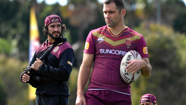 INJURED STAR: Johnathan Thurston (left) looks on during the Queensland State of Origin team training session at Sanctuary Cove on the Gold Coast. Picture: DAVE HUNT