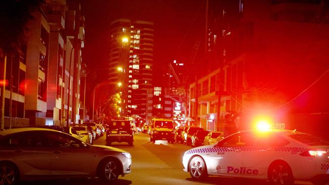 Police at the scene where a man was shot in the car park under Rhodes shopping centre. Picture: Damian Shaw