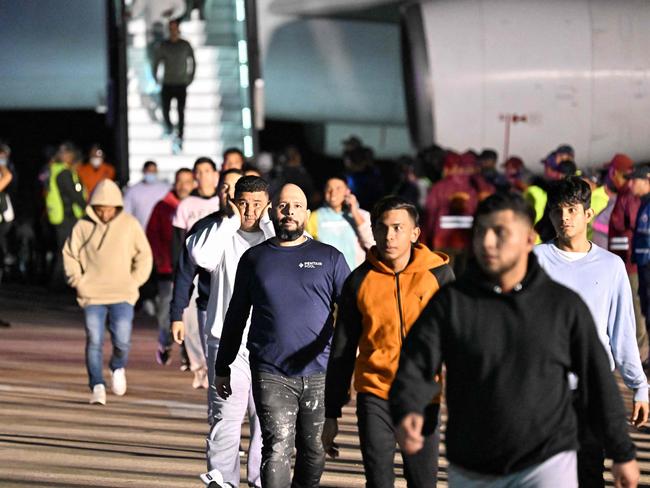 Venezuelan migrants deported from the United States disembark from a Conviasa Airlines plane upon arrival at Simon Bolivar International Airport in Maiquetia, Venezuela. Picture: AFP