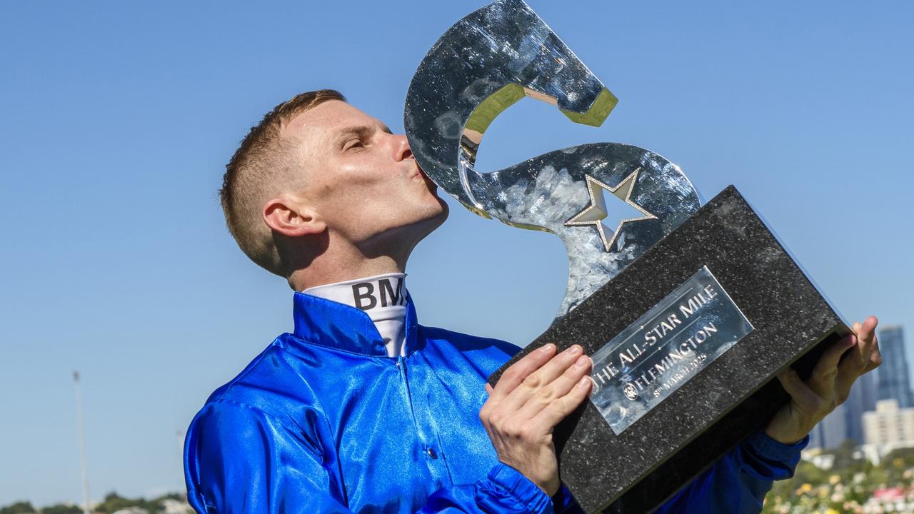 Ben Melham kisses then All-Star Mile trophy. Picture: Vince Caligiuri/Getty Images