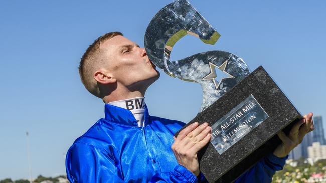 Ben Melham kisses then All-Star Mile trophy. Picture: Vince Caligiuri/Getty Images