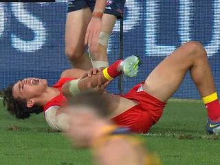 Will Powell’s sickening injury brings Suns vs Crows game to standstill