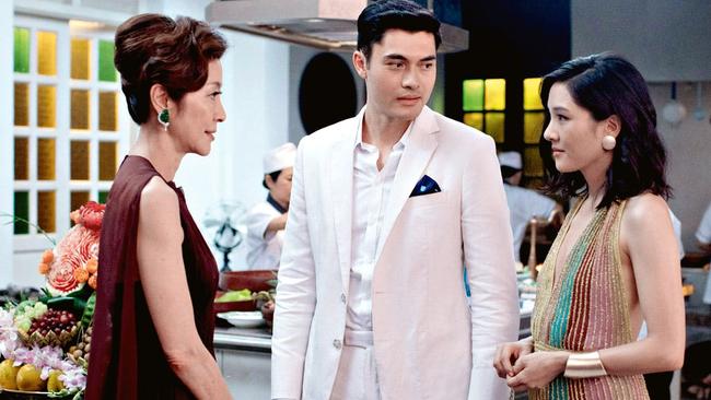 As Eleanor Young in Crazy Rich Asians with Henry Golding and Constance Wu.