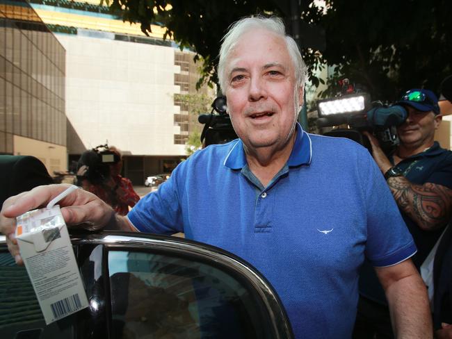 Embattled businessman Clive Palmer leaves the Federal Court with his barrister Andrew Boe (right) after giving evidence at the public examination of the collapse of Queensland Nickel.Photo: Claudia Baxter