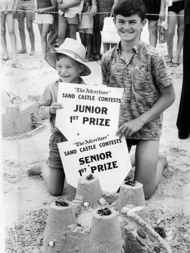 Advertiser sandcastle contest winners Brian Clarke, 7, of Plympton Park, with his brother Peter, 13, and Peter’s winning castle at Glenelg Beach, 1965.