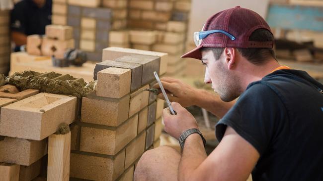 Bricklaying competitor Trystan Sammut assesses his work. Picture: Supplied