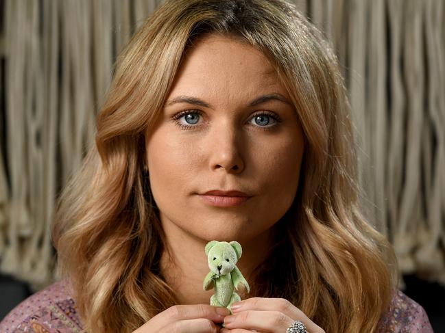 Lauren Ralph cherishes a tiny green teddy bear that she's kept as a memento of her sister. Picture: Tricia Watkinson