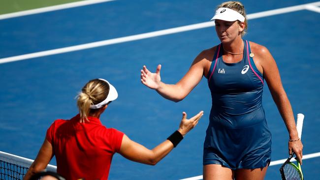 Kirsten Flipkens of Belgium shakes hands with Coco Vandeweghe of the United States after defeating her in their women's singles first round match. Photo: Getty Images