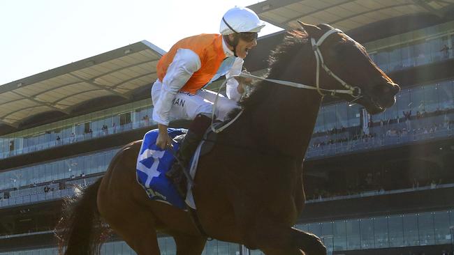 Hugh Bowman celebrates after steering Montefilia to victory in the Flight Stakes. Picture: Getty Images