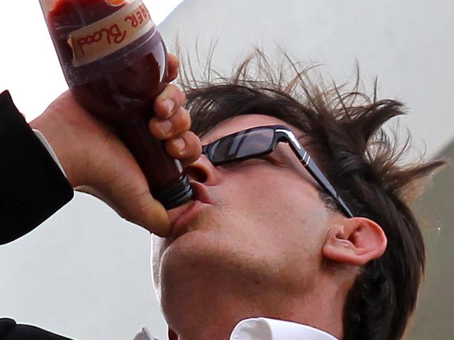 Actor Charlie Sheen is seen on the rooftop of Live Nation building drinking 'Tiger Blood' in Beverly Hills , California 07/03/2011. Pic Jean Baptiste Lacroix/WireImage.