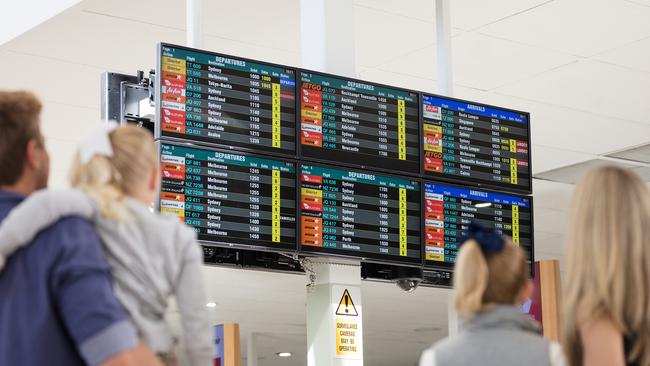 Checking out arrival and departure boards at the Gold Coast Airport at Bilinga.