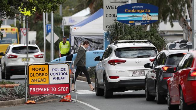 Motorists queue at the Queensland border police checkpoint in Coolangatta. Picture: NIGEL HALLETT