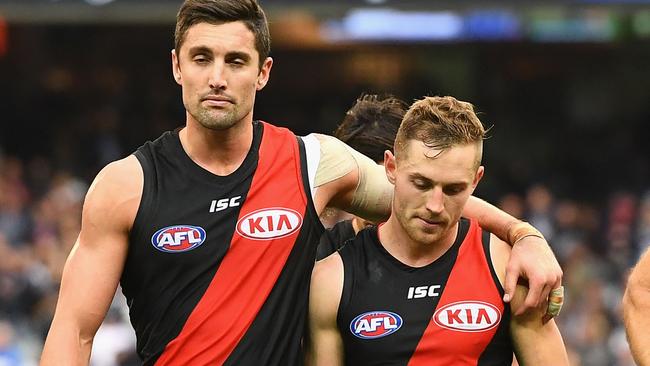 David Myers and Devon Smith walk off the MCG after the loss. Picture: Getty