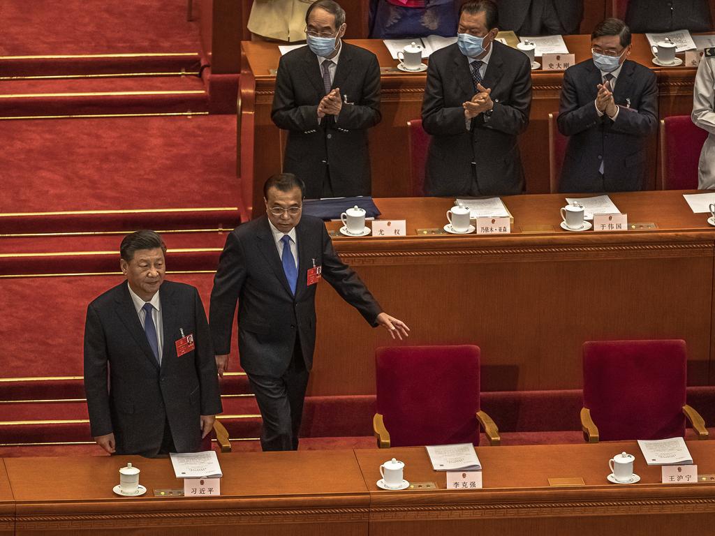 Chinese President Xi Jinping, left, and Premier Li Keqiang arrive for the second plenary session of China's National People's Congress. Picture: Roman Pilipey/AP