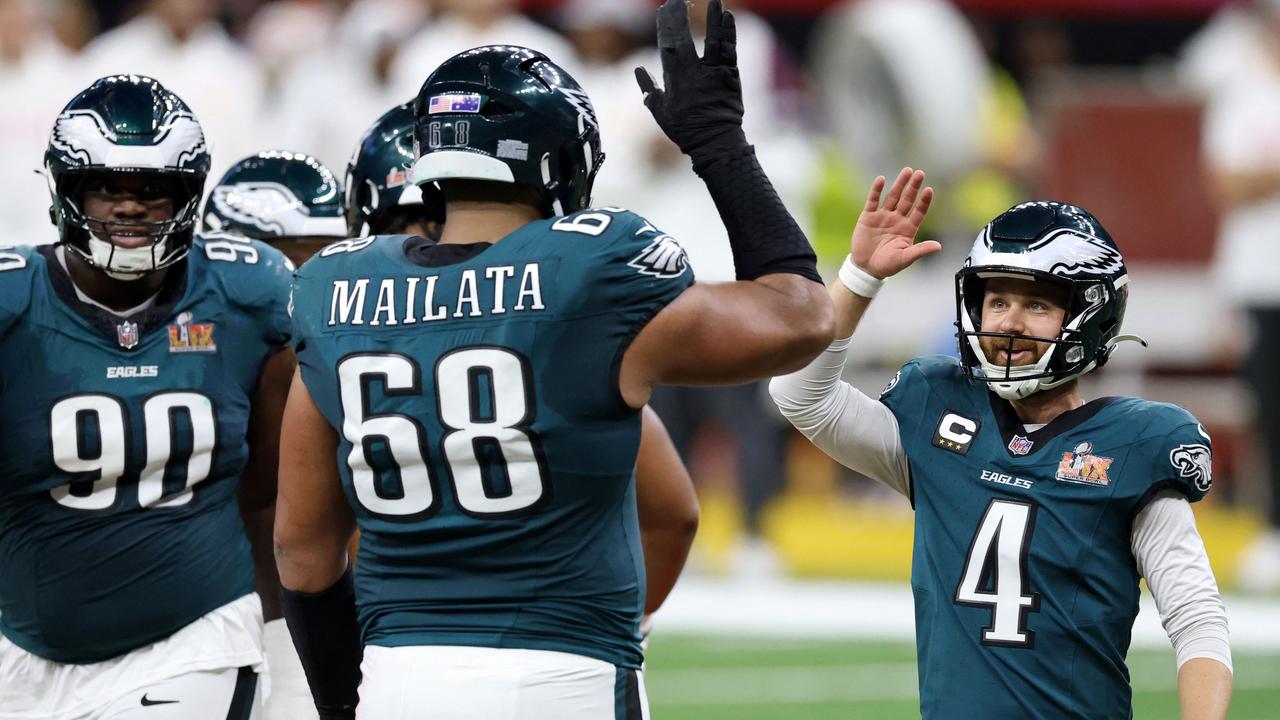 Jordan Mailata celebrates with Jake during the second quarter against the Kansas City Chiefs. Picture: Emilee Chinn/Getty Images