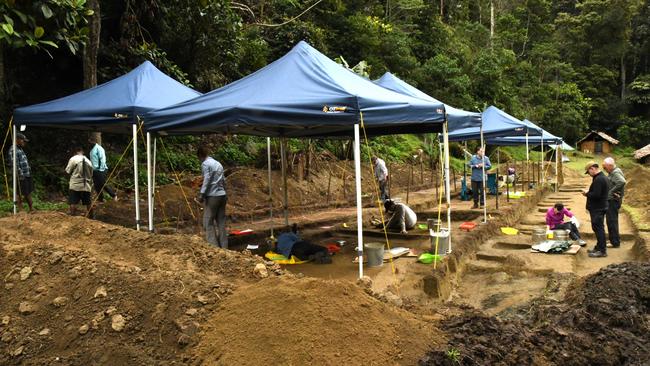 Experts carefully sift through soil at the excavation site. Picture: Department of Defence