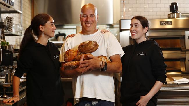 Michael Cthurmer with daughters Lily (left) and Meshi (right) at The Grumpy Baker in Neutral Bay. Picture: Sam Ruttyn