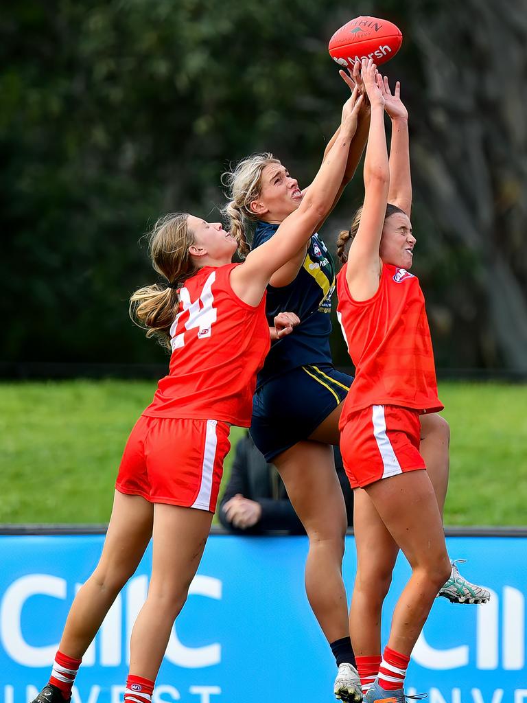 Alexis Gregor (left) goes up for the contest against Havana Harris and Scout Howden in an AFL Academy v All Stars game. Picture: Josh Chadwick/AFL Photos/via Getty Images