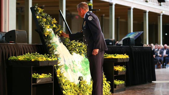 CFA chief Steve Warrington pays his respects. Picture: Michael Dodge/Getty Images