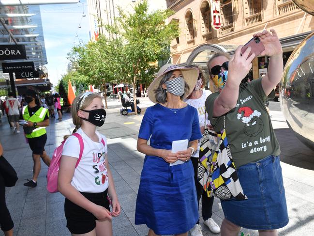 27/11/20. Nicola Spurrier will be giving out the Advertiser and masks in Rundle Mall at Malls Balls.Alyssa - 9, Nicola and Kylie Carlesso (0419 825 394)Picture: Keryn Stevens