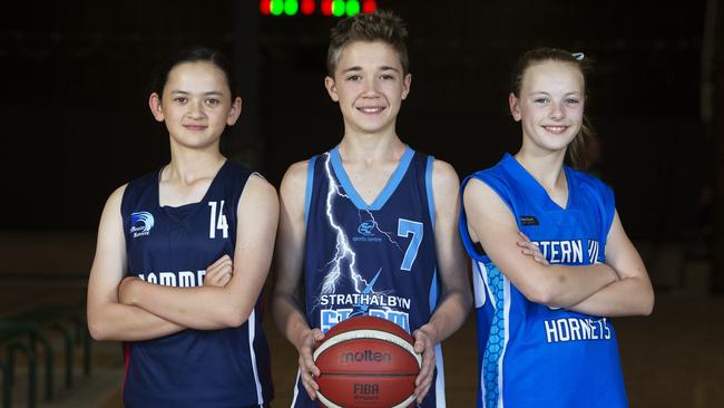 Maddison Dinh (Great Southern), Cooper Foote (Strathalbyn Storm) and Isla Millard (Eastern Hills) are ready for the under-14 SA Country Junior Basketball Championships, which will be live streamed by The Advertiser. Picture: Emma Brasier