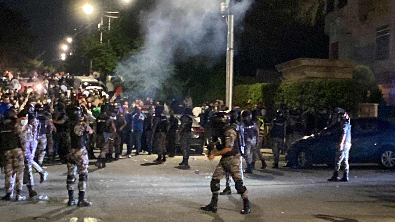 Jordanian security forces fire tear gas at demonstrators attempting to storm the Israeli embassy in the capital of Amman. Picture: AFP