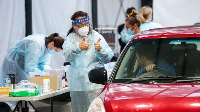 The nurse gives the motorist a thumbs up after his test. Picture: Ian Currie