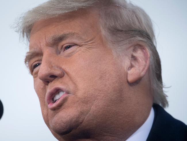 US President Donald Trump speaks during a Make America Great Again rally at Capital Region International Airport October 27, 2020, in Lansing, Michigan. - Democrat Joe Biden was campaigning in the once reliably Republican state of Georgia on Tuesday and President Donald Trump was hopscotching across the Midwest as the US election campaign entered its final week. Biden, 77, who is leading in the polls ahead of the November 3 vote, was to hold a socially distanced drive-in car rally in Atlanta, Georgia's largest city. (Photo by Brendan Smialowski / AFP)